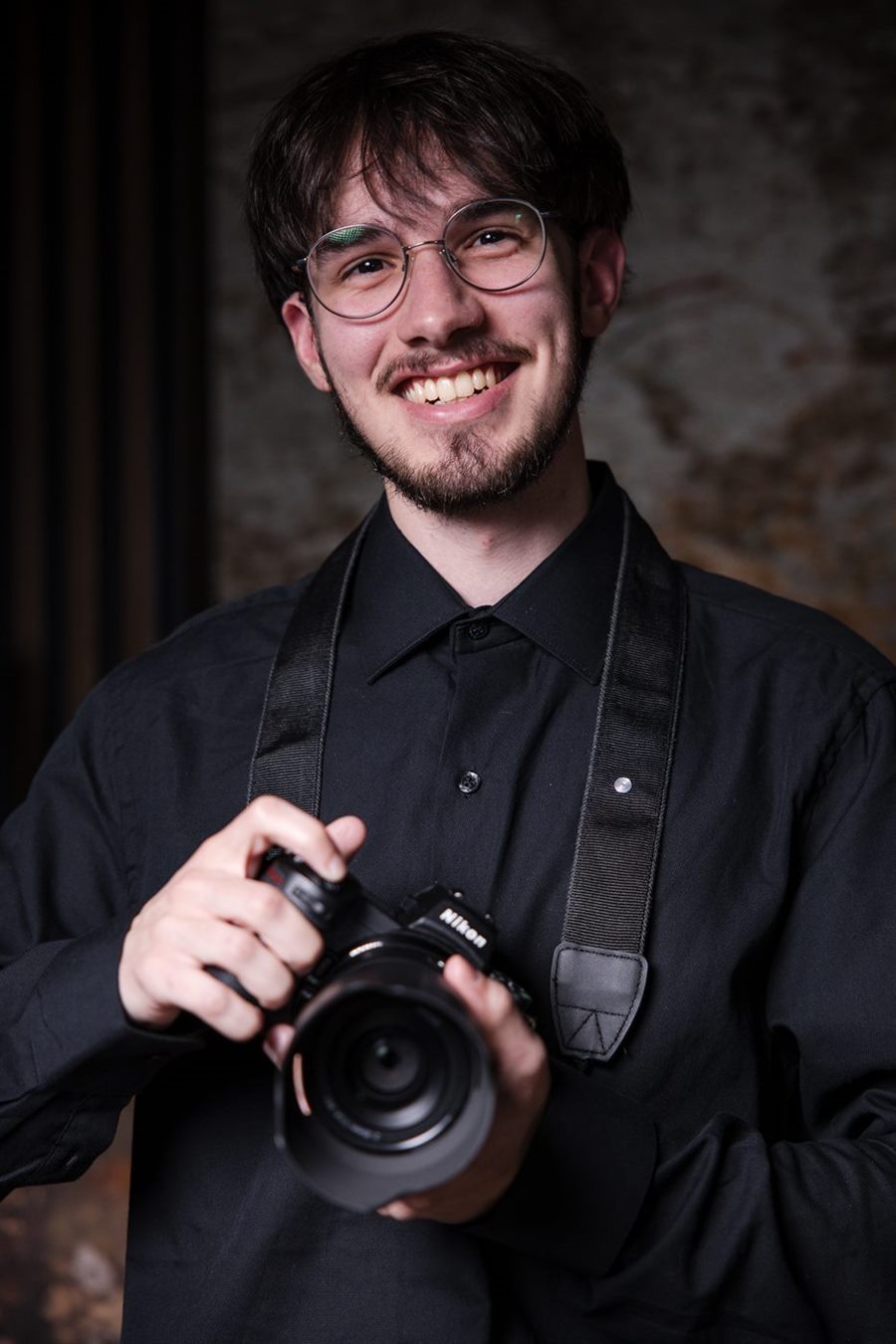 Nick Schluth holding a camera